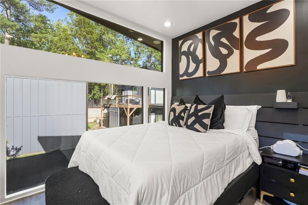 3120 Godby Road, Unit 1107 Atlanta, GA 30349 - Photo 17 of 29 a large bed sitting in a bedroom next to a window