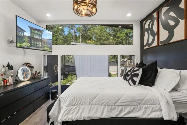 a bedroom with a bed and dresser