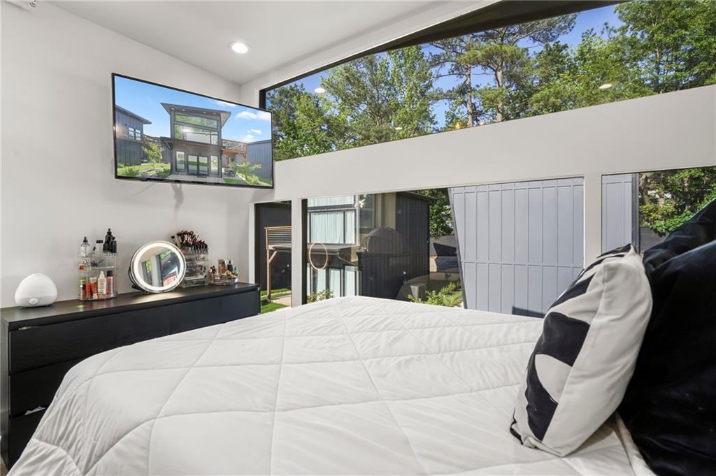 3120 Godby Road, Unit 1107 Atlanta, GA 30349 - Photo 20 of 29 a bedroom with a bed and a large window