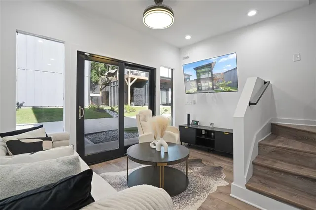 a living room with furniture and a large window