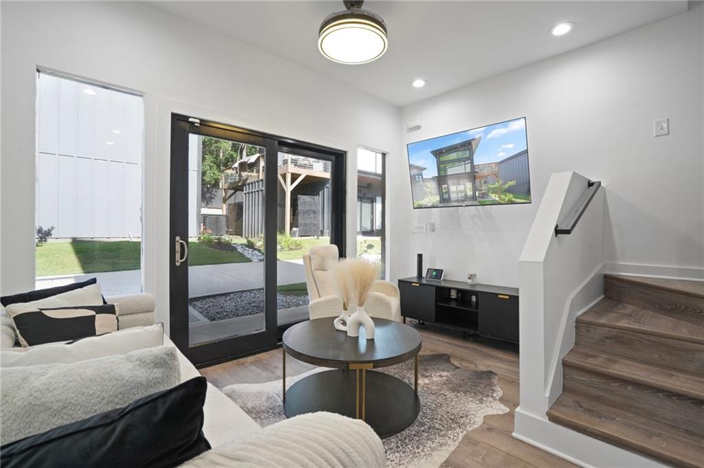 3120 Godby Road, Unit 1107 Atlanta, GA 30349 - Photo 2 of 29 a living room with furniture and a large window