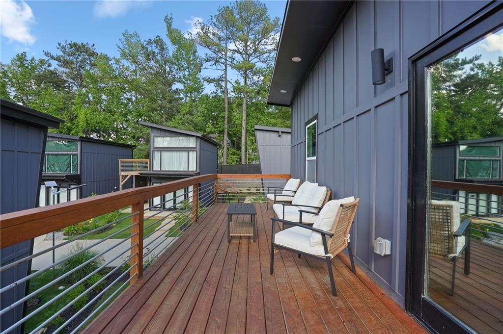 3120 Godby Road, Unit 1107 Atlanta, GA 30349 - Photo 22 of 29 a view of balcony with furniture and outdoor seating