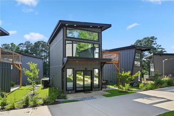 a front view of a house with garden