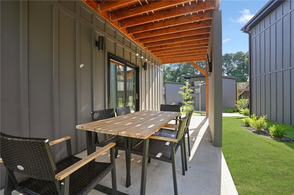 3120 Godby Road, Unit 1107 Atlanta, GA 30349 - Photo 25 of 29 a view of an outside dining space with furniture