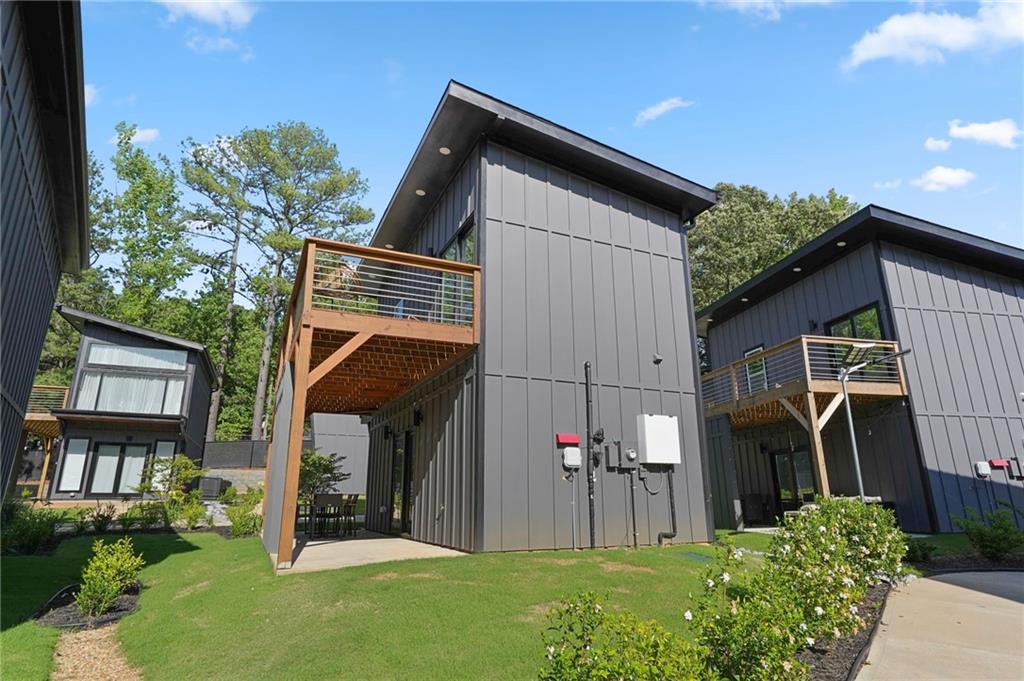 3120 Godby Road, Unit 1107 Atlanta, GA 30349 - Photo 27 of 29 a front view of a house with a yard