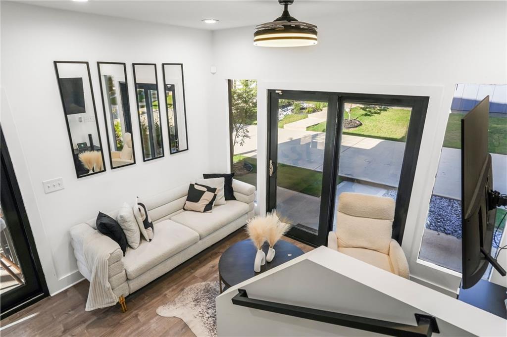 3120 Godby Road, Unit 1107 Atlanta, GA 30349 - Photo 3 of 29 a living room with furniture and a window