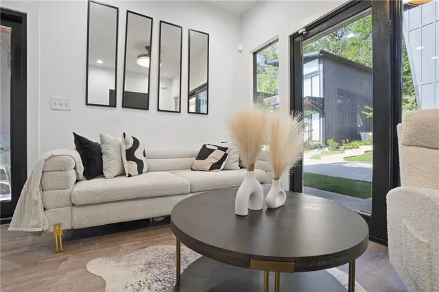 a living room with furniture and a large window