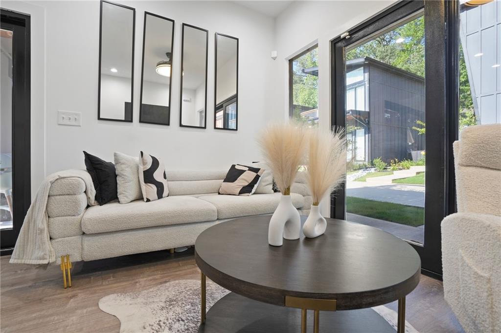3120 Godby Road, Unit 1107 Atlanta, GA 30349 - Photo 4 of 29 a living room with furniture and a large window