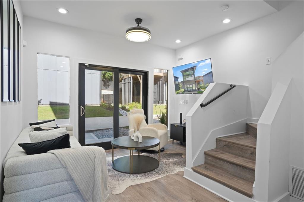 3120 Godby Road, Unit 1107 Atlanta, GA 30349 - Photo 5 of 29 a living room with furniture and a fireplace