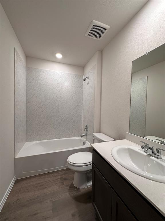 3917 Turquoise Avenue Celina, TX 75009 - Photo 11 of 19 a bathroom with a double vanity sink toilet mirror and bathtub