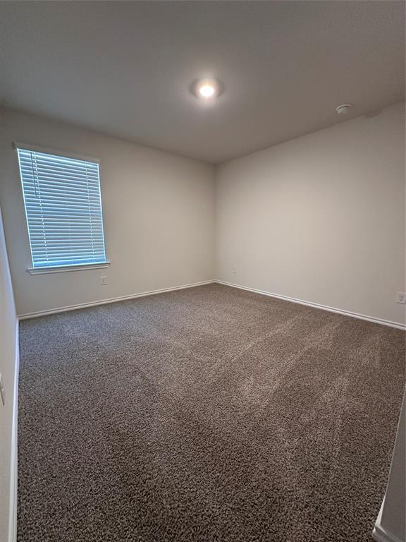 3917 Turquoise Avenue Celina, TX 75009 - Photo 12 of 19 an empty room with a empty space and window