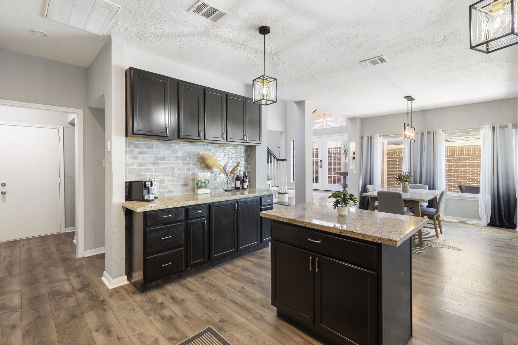 2110 Paso Rello Drive Houston, TX 77077 - Photo 14 of 41 a kitchen with granite countertop a sink cabinets and wooden floor