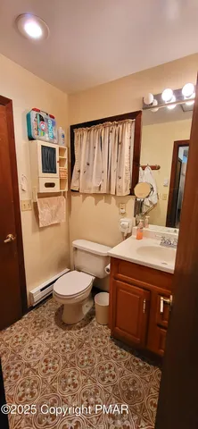 a bedroom with a bed next to a large window