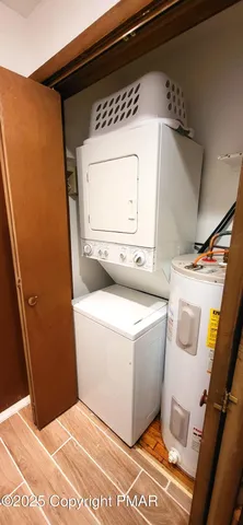 a view of a backyard with table and chairs and potted plants