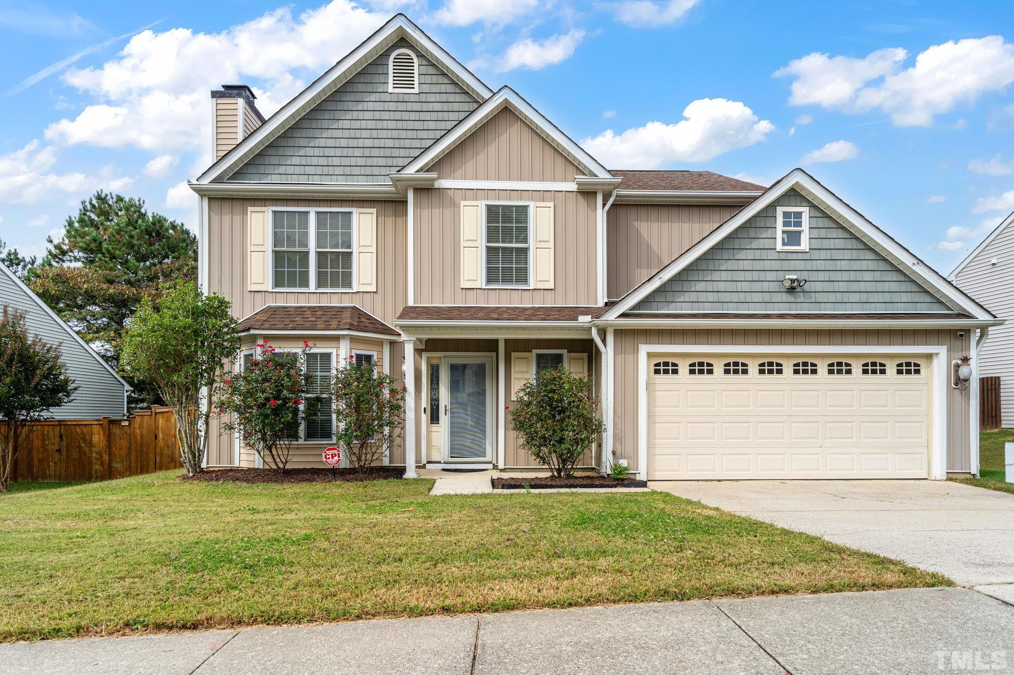5219 Cardinal Grove Boulevard Raleigh, NC 27616 - Photo 1 of 43 a front view of a house with a yard