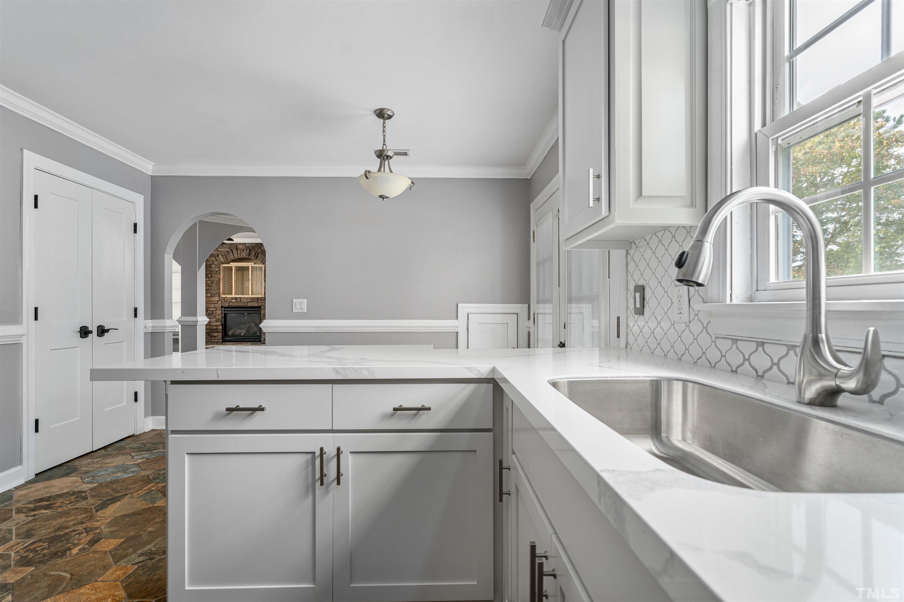 5219 Cardinal Grove Boulevard Raleigh, NC 27616 - Photo 18 of 43 a kitchen with a sink cabinets and window