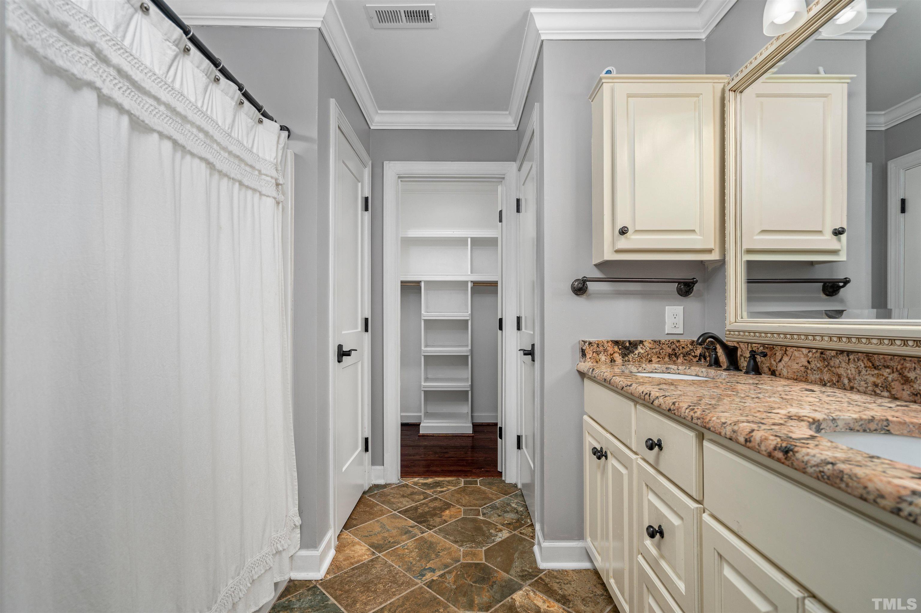 5219 Cardinal Grove Boulevard Raleigh, NC 27616 - Photo 29 of 43 a bathroom with a granite countertop sink and a mirror