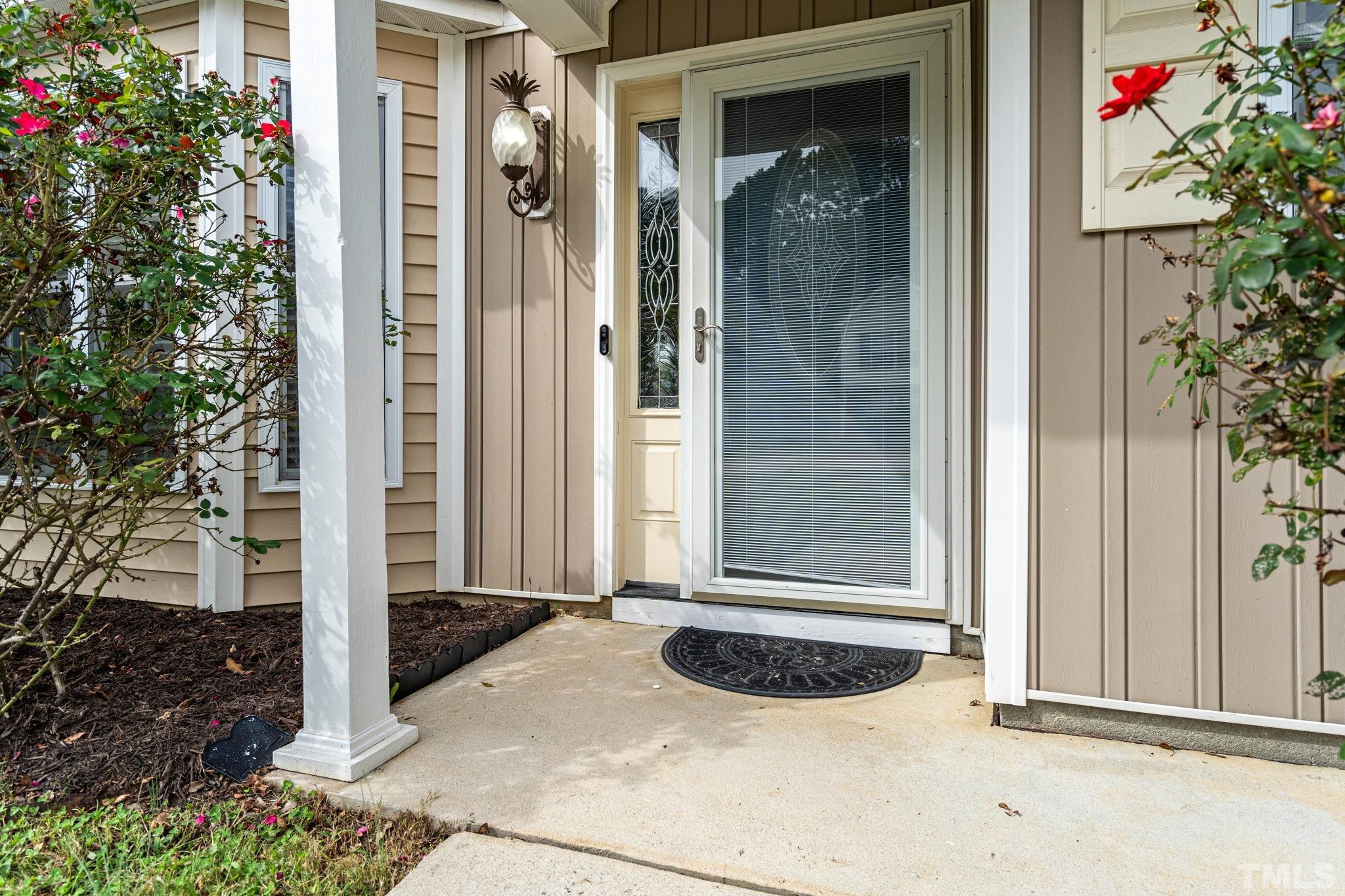 5219 Cardinal Grove Boulevard Raleigh, NC 27616 - Photo 3 of 43 a front view of a house with plants