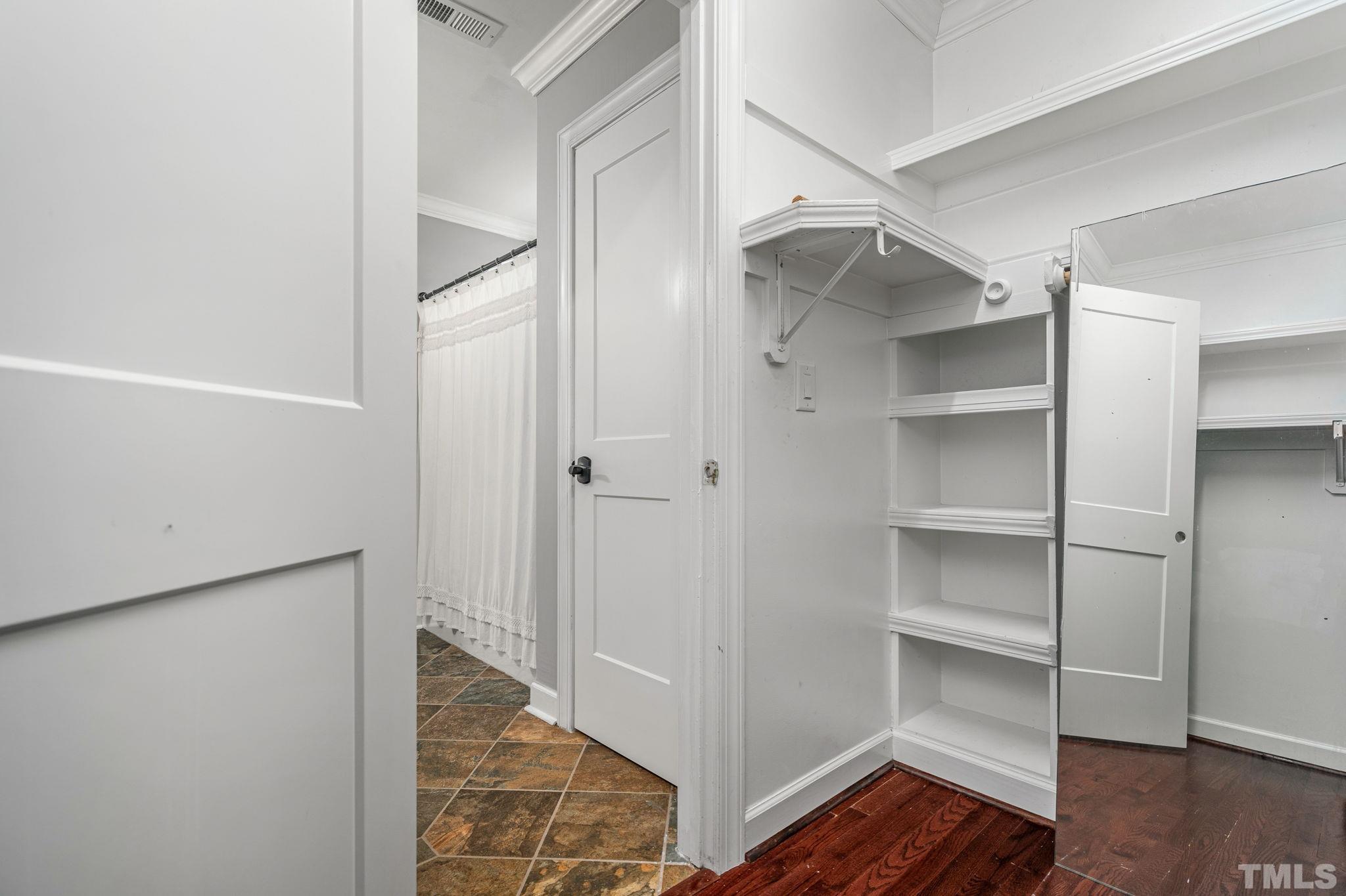 5219 Cardinal Grove Boulevard Raleigh, NC 27616 - Photo 31 of 43 a view of walk in closet with empty racks