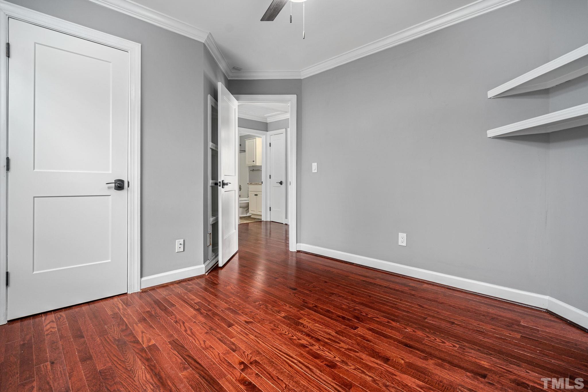 5219 Cardinal Grove Boulevard Raleigh, NC 27616 - Photo 33 of 43 a view of an empty room and wooden floor