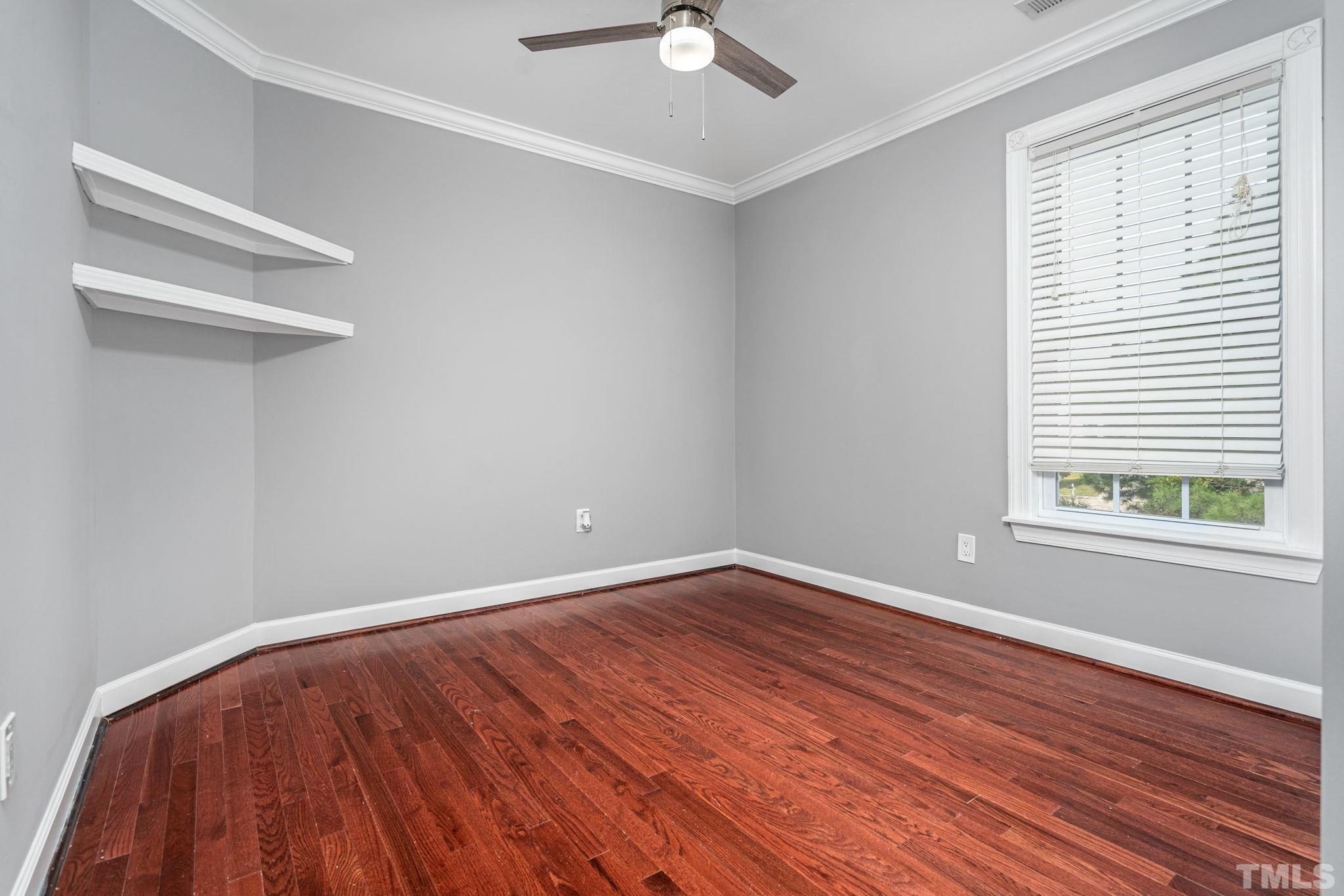 5219 Cardinal Grove Boulevard Raleigh, NC 27616 - Photo 34 of 43 wooden floor in an empty room with a window
