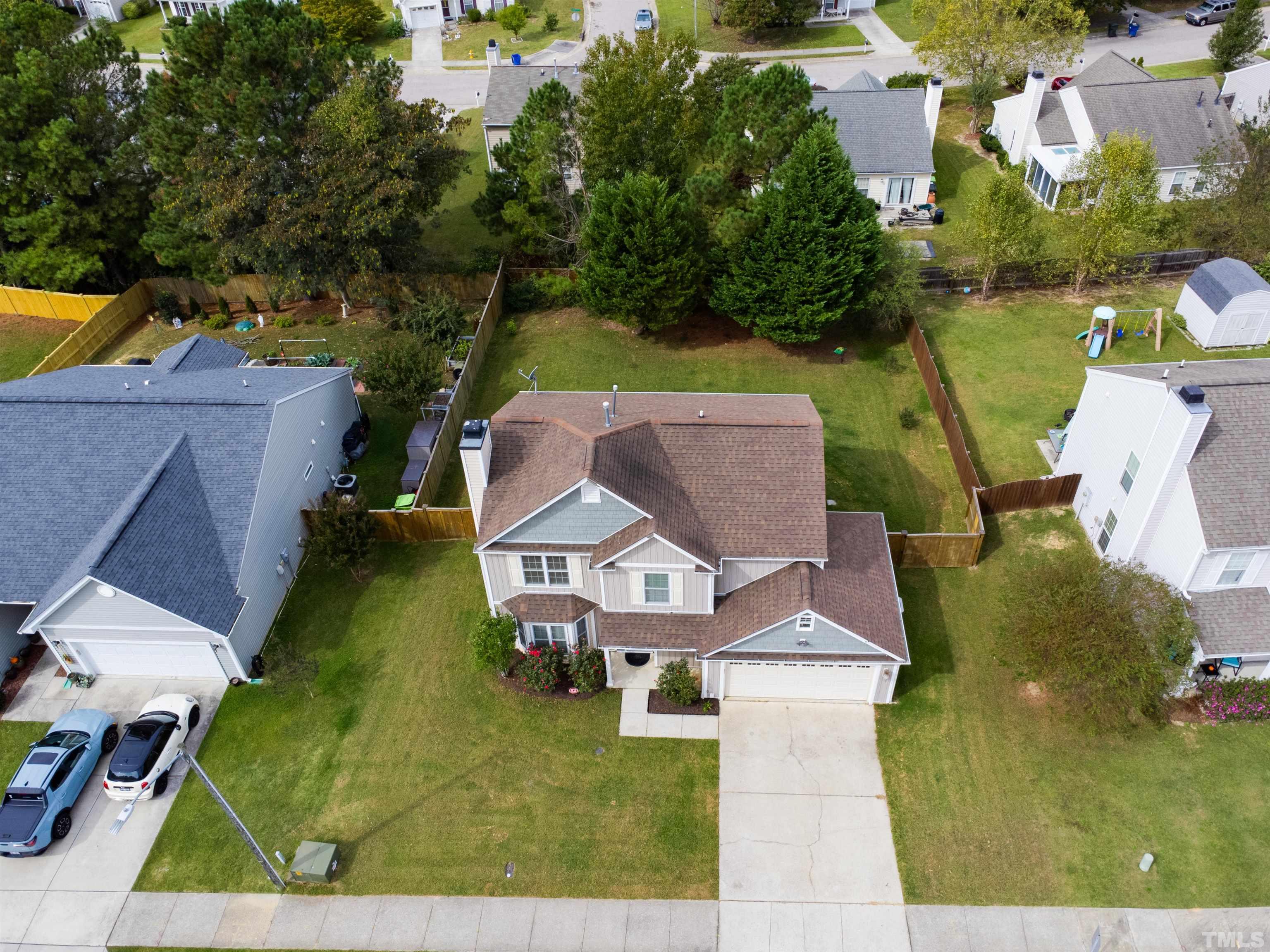 5219 Cardinal Grove Boulevard Raleigh, NC 27616 - Photo 4 of 43 an aerial view of a house with a garden and swimming pool