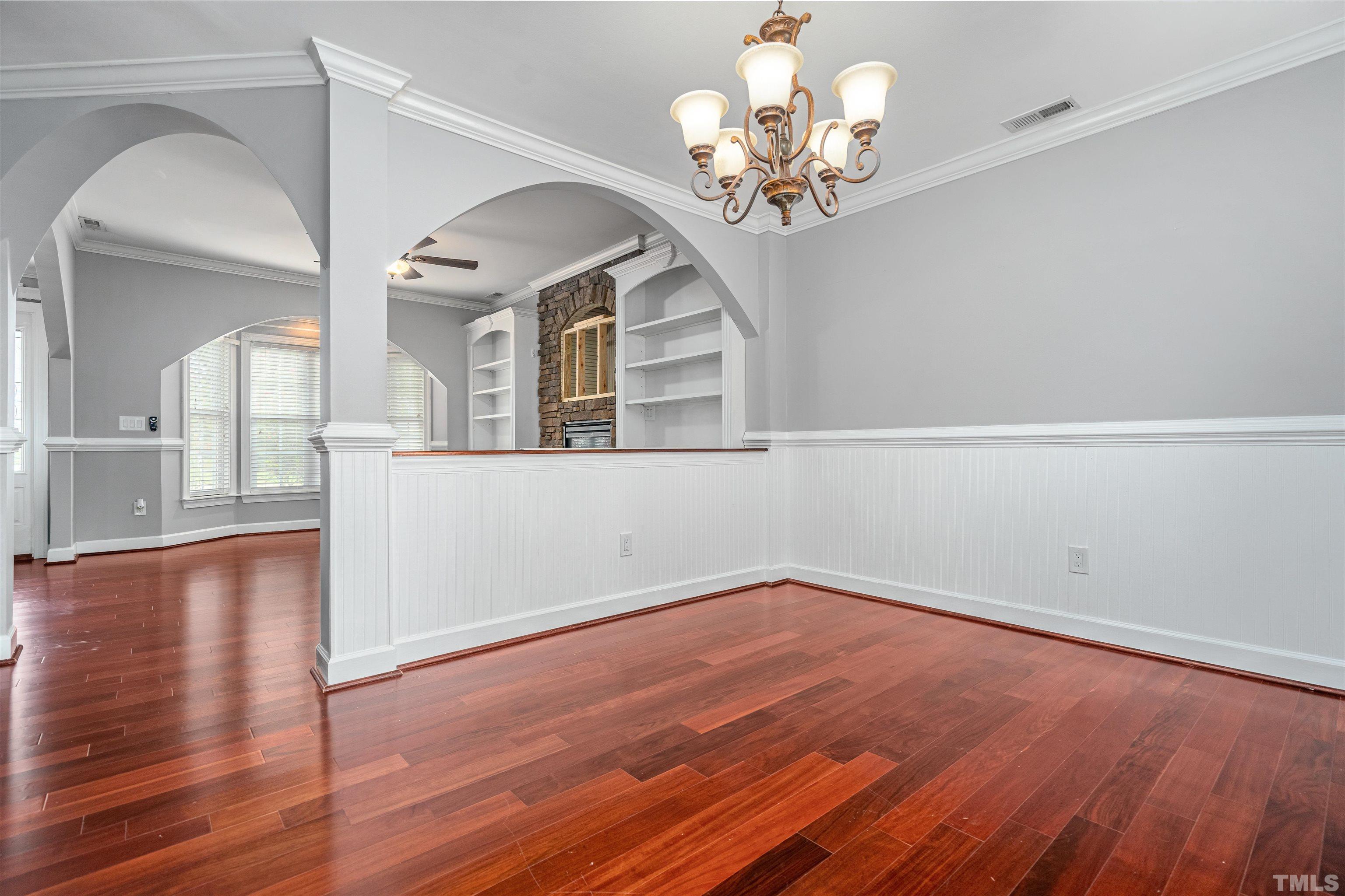 5219 Cardinal Grove Boulevard Raleigh, NC 27616 - Photo 10 of 43 wooden floor in an empty room with a window