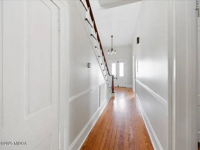 a view of gallery with wooden floor