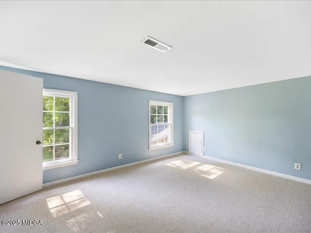 an empty room with windows