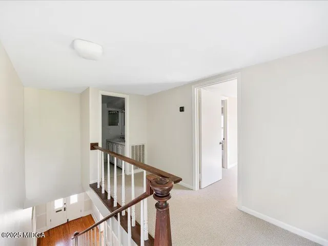 a view of an entryway with wooden floor