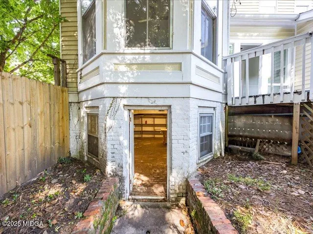 a view of a brick house with a large windows