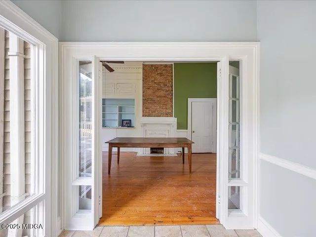 a view of living room filled with furniture and window