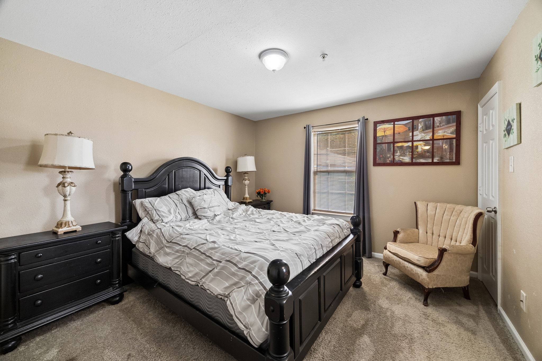 2013 Ellis School Road Baytown, TX 77521 - Photo 9 of 31 Spacious and versatile master bedroom offers a comfortable, thoughtfully arranged layout with ample room for restful sleeping accommodations, a private home office, creative studio, fitness area, or welcoming guest retreat. Its flexible design and turn-key furnishings make it easy to adapt to a variety of resident or short-term guest needs.