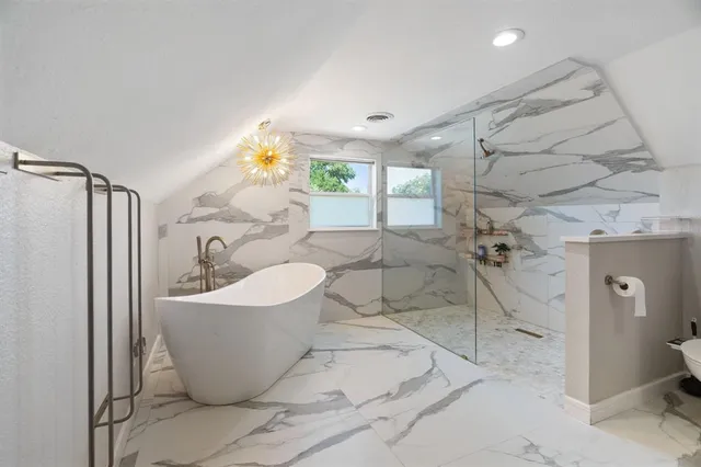 a view of a livingroom with furniture and windows