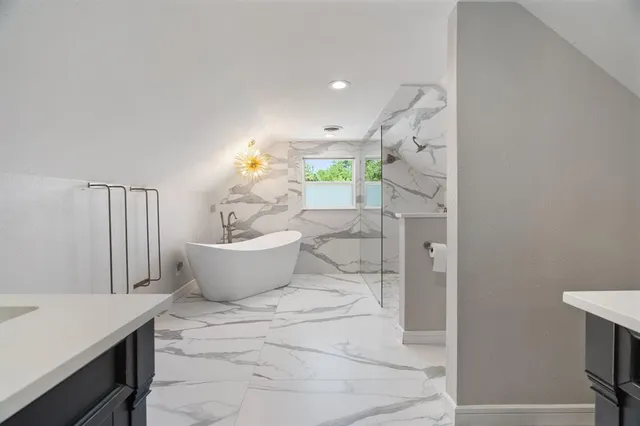 a bath room with a toilet and a shower