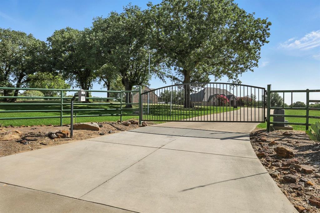 12886 St John Road Pilot Point, TX 76258 - Photo 2 of 35 a view of a park with large trees