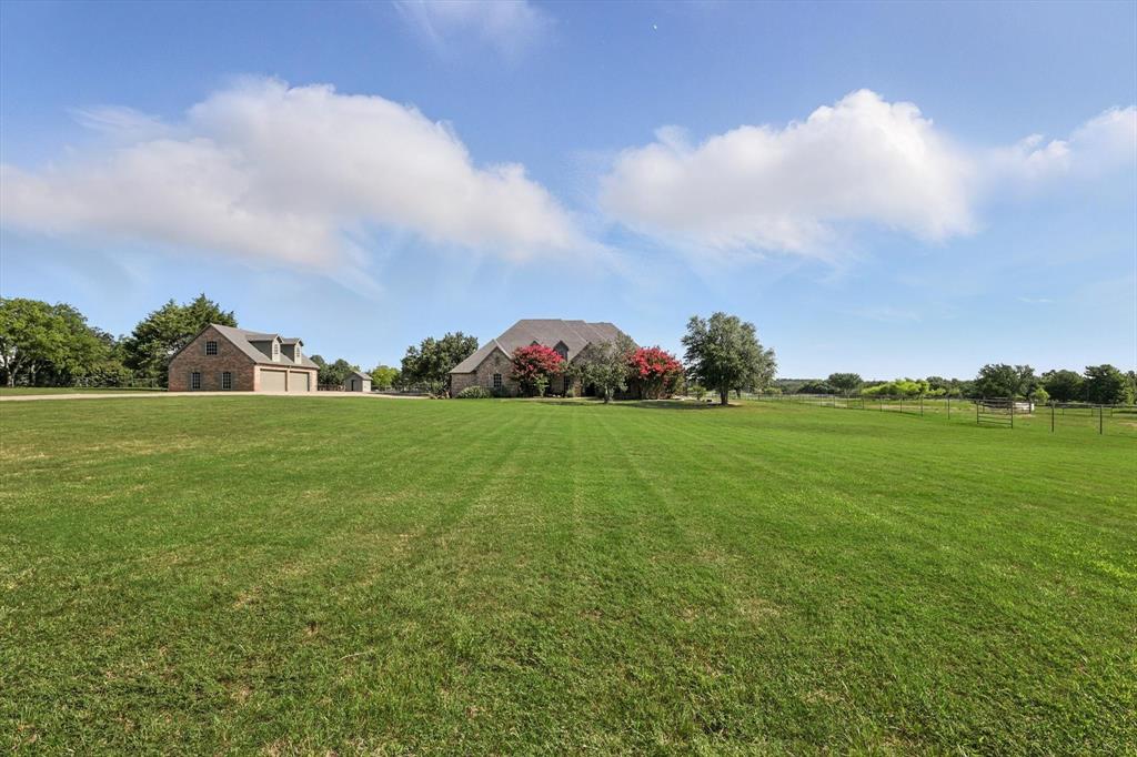 12886 St John Road Pilot Point, TX 76258 - Photo 26 of 35 a view of building with garden