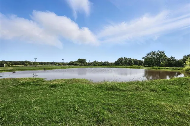 a view of a lake with a big yard