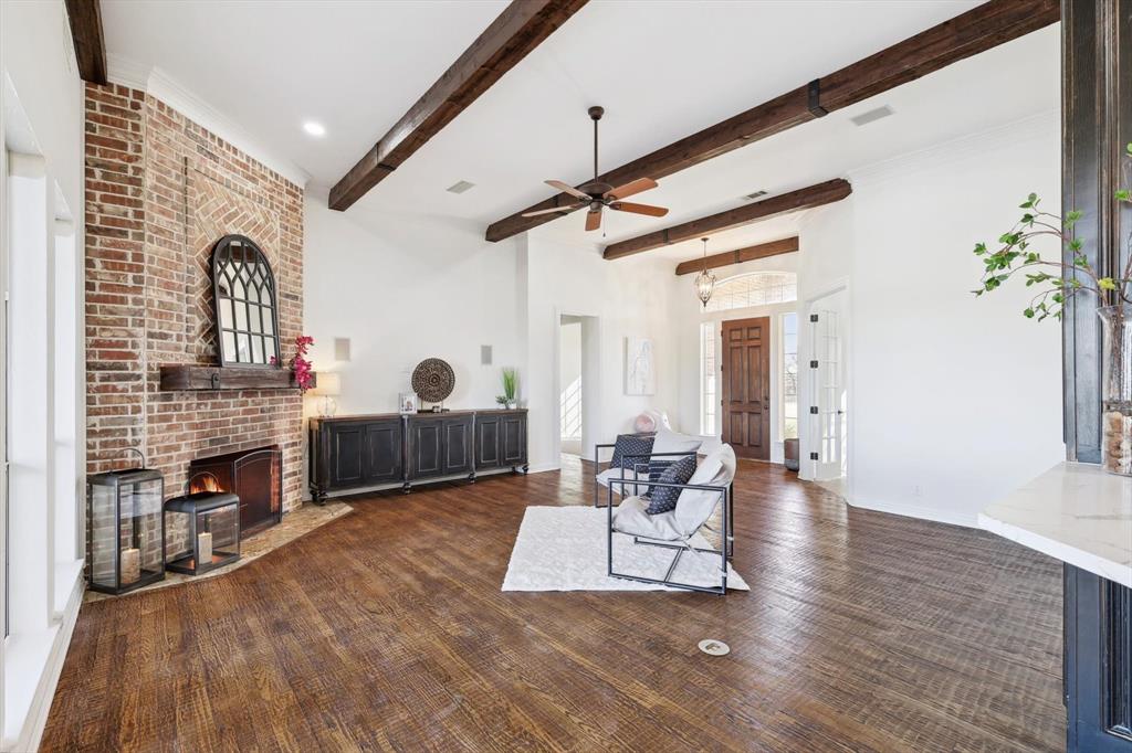 12886 St John Road Pilot Point, TX 76258 - Photo 10 of 35 a living room with furniture a fireplace and a table
