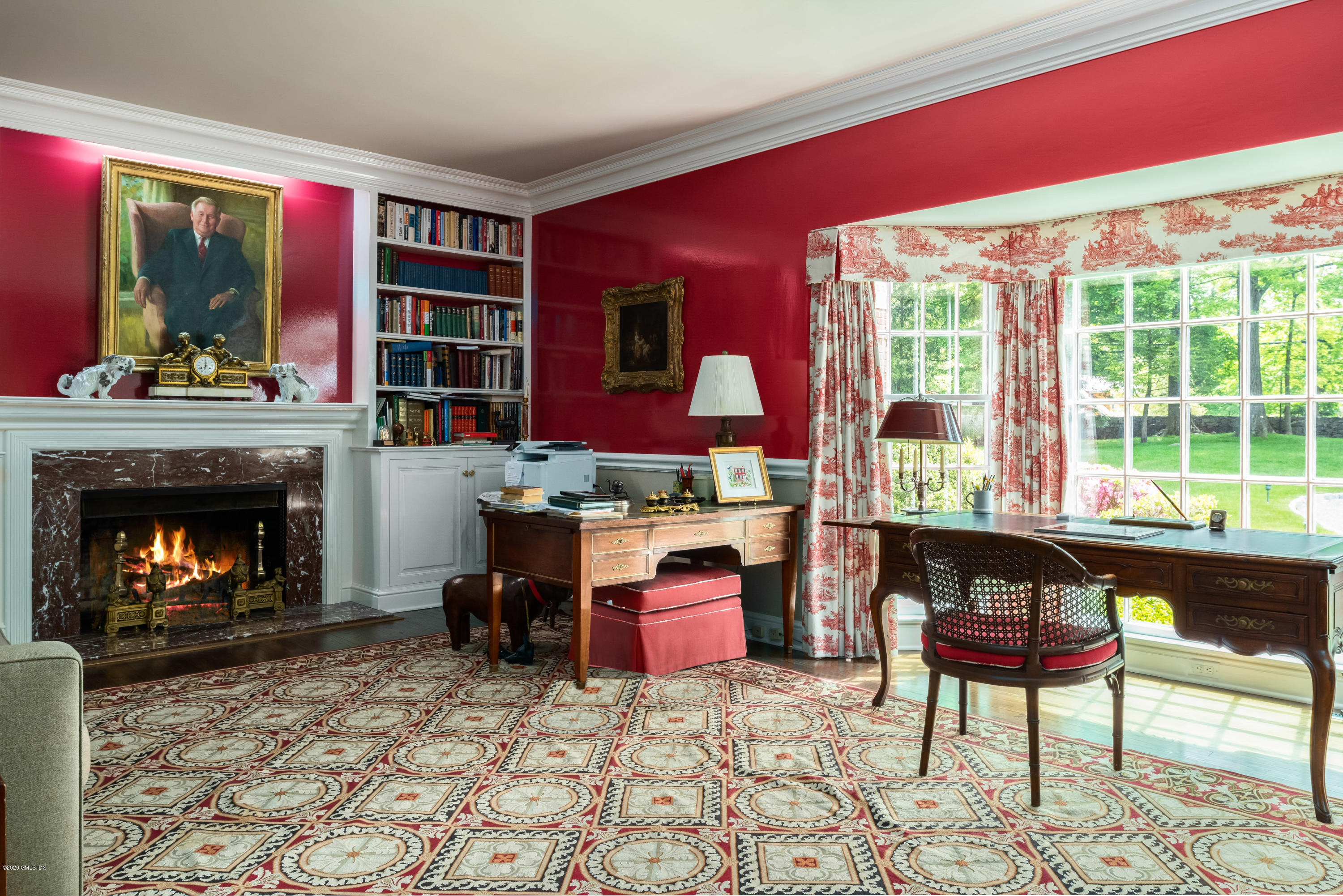 191 Clapboard Ridge Road Greenwich, CT 06831 - Photo 11 of 23 a living room with furniture a fireplace and a floor to ceiling window