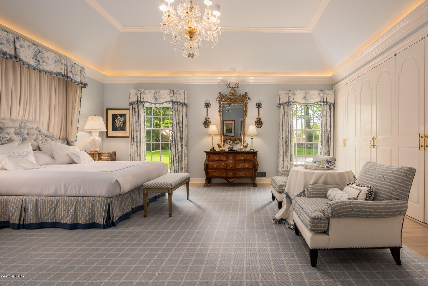 191 Clapboard Ridge Road Greenwich, CT 06831 - Photo 12 of 23 a spacious bedroom with a bed couch and windows