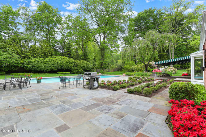 191 Clapboard Ridge Road Greenwich, CT 06831 - Photo 17 of 23 a view of backyard with seating space and trees