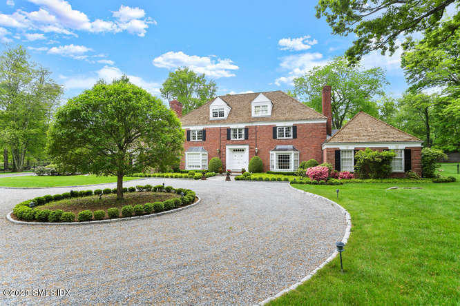 191 Clapboard Ridge Road Greenwich, CT 06831 - Photo 3 of 23 a front view of a house with a yard