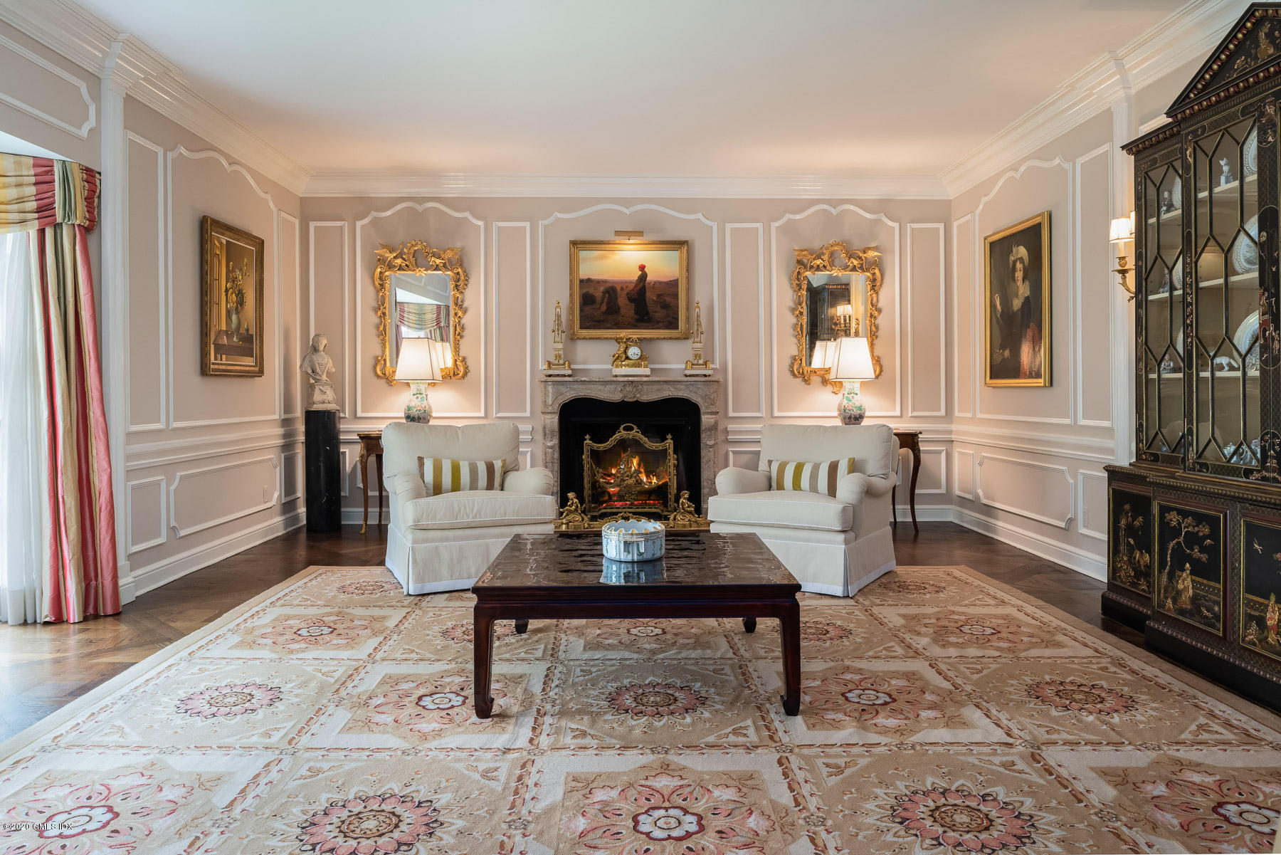 191 Clapboard Ridge Road Greenwich, CT 06831 - Photo 7 of 23 a living room with furniture a fireplace and a table