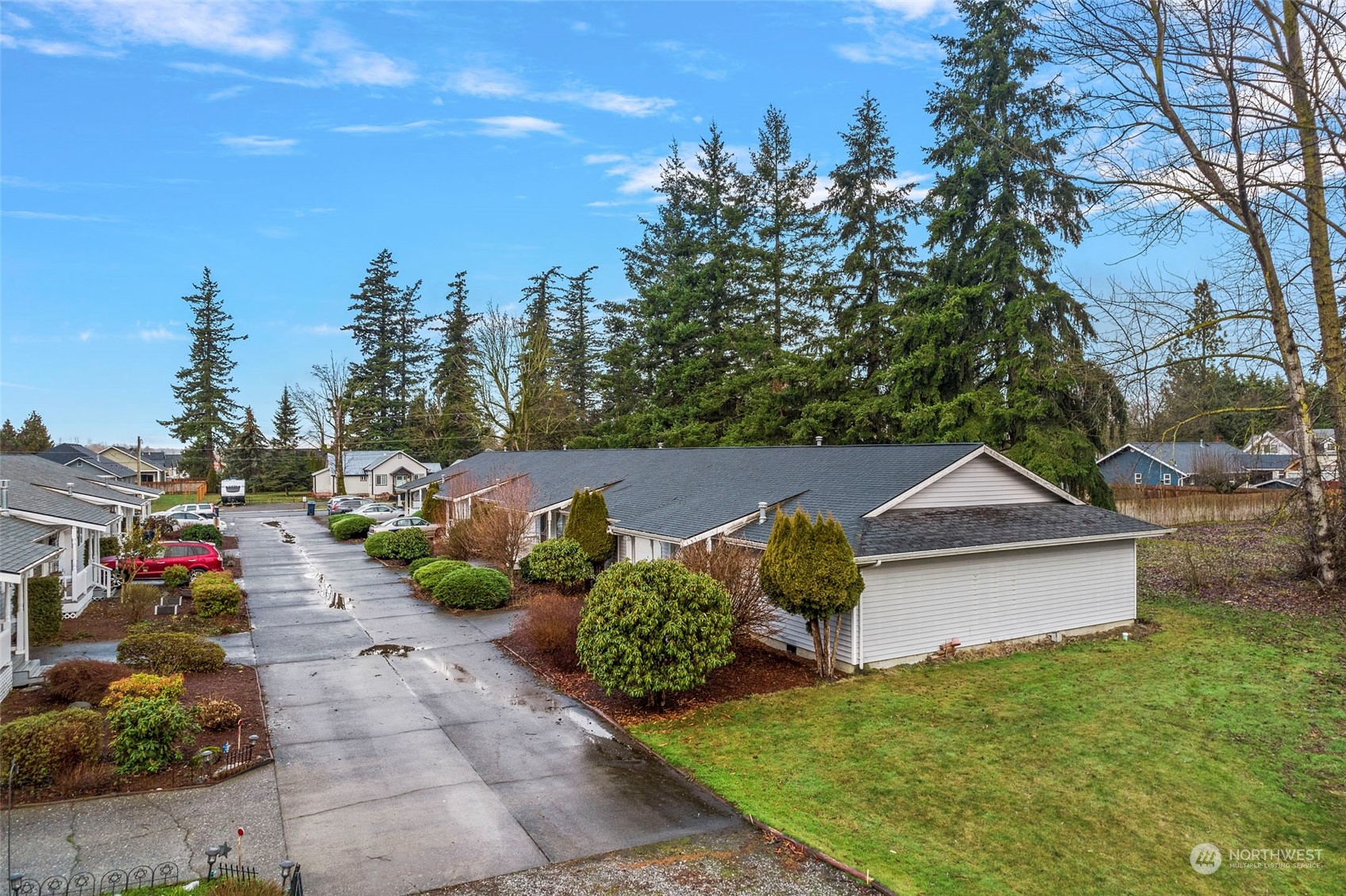 312 West 2nd Street, Unit ABCD Nooksack, WA 98276 - Photo 1 of 23 a backyard of a house with lots of green space