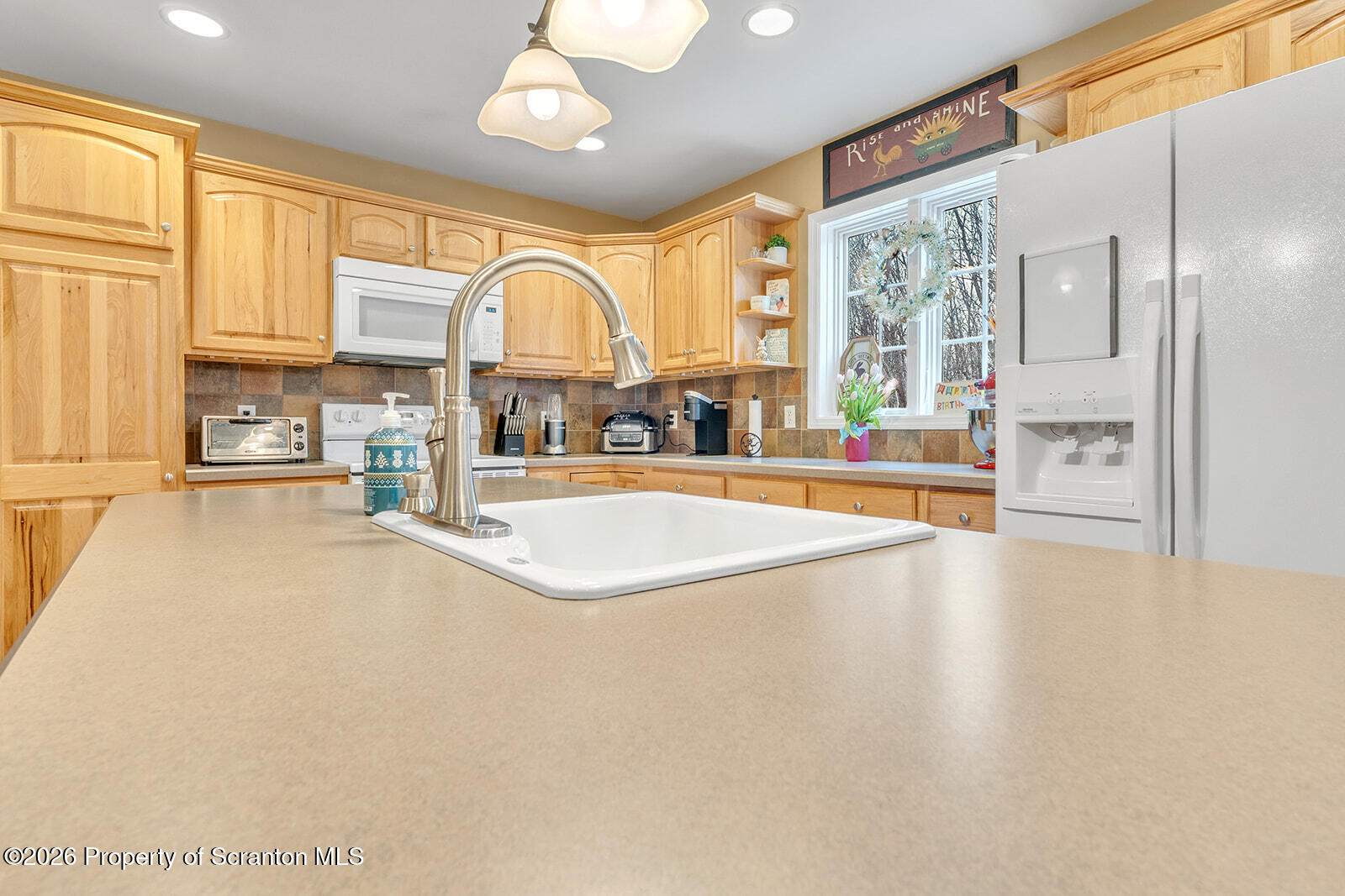 1611 Cherry Street Scranton, PA 18505 - Photo 34 of 86 a view of a kitchen with kitchen island a large window a sink and stainless steel appliances
