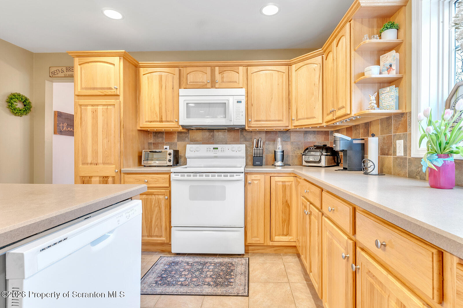 1611 Cherry Street Scranton, PA 18505 - Photo 36 of 86 a kitchen with a white cabinets and window