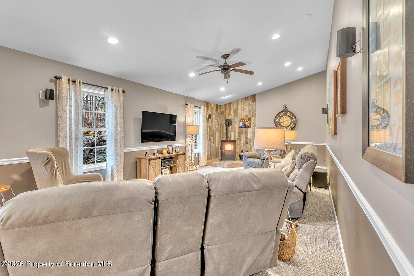 1611 Cherry Street Scranton, PA 18505 - Photo 42 of 86 a living room with furniture a flat screen tv and a large window