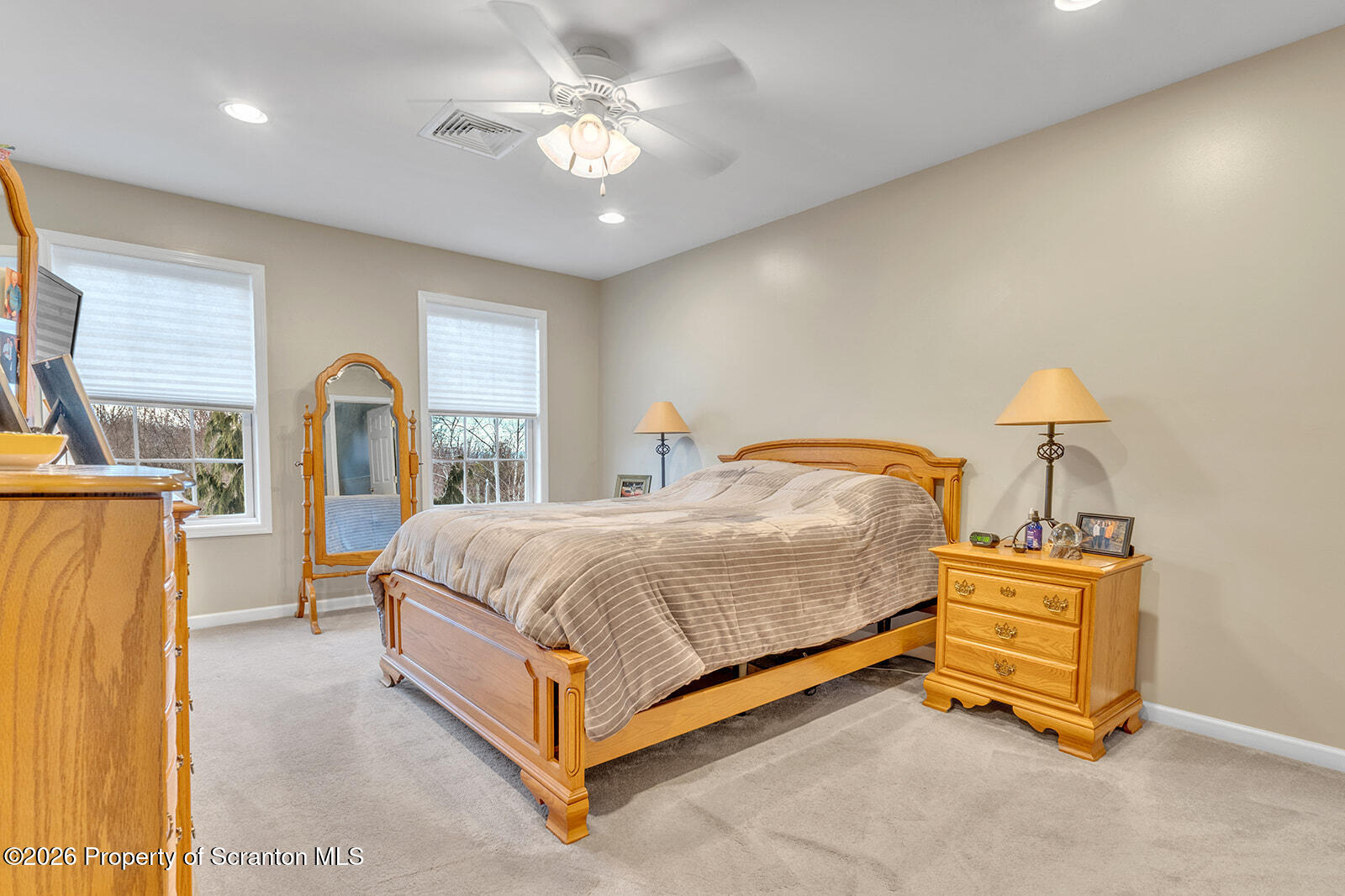 1611 Cherry Street Scranton, PA 18505 - Photo 51 of 86 a spacious bedroom with a bed and a chandelier