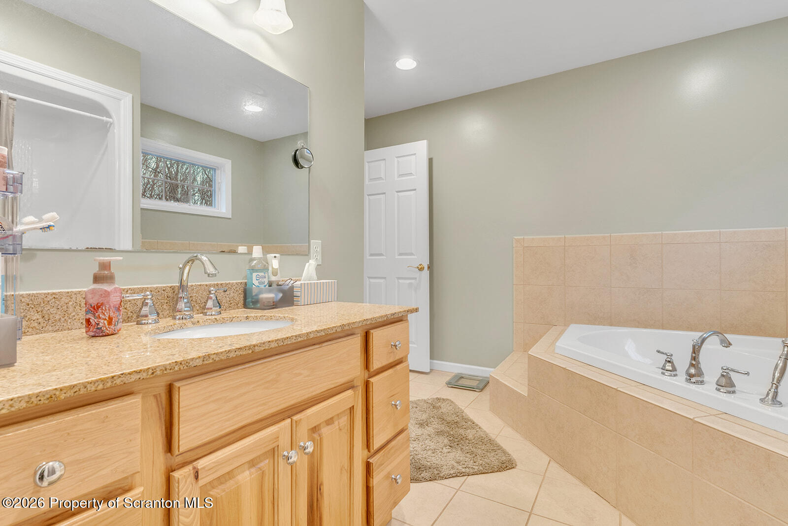 1611 Cherry Street Scranton, PA 18505 - Photo 56 of 86 a bathroom with a tub sink and mirror